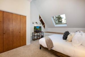 a bedroom with a bed and a wooden cabinet at 175 Wildwood Dr Unit 3 in Pagosa Springs