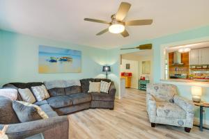 a living room with a couch and a ceiling fan at Deck, Grill and Fire Pit Waterfront Texas Retreat in Tool