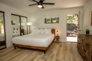 a bedroom with a bed and a ceiling fan at 785 Aspenglow Blvd ("Bear's Cliff") in Pagosa Springs