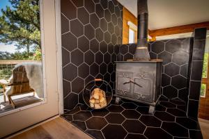 a wood fired stove in a kitchen next to a door at 785 Aspenglow Blvd ("Bear's Cliff") in Pagosa Springs