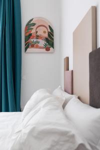 Letto o letti in una camera di Nimar Suite