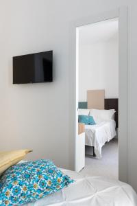 Letto o letti in una camera di Nimar Suite