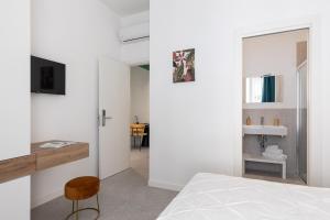 Letto o letti in una camera di Nimar Suite