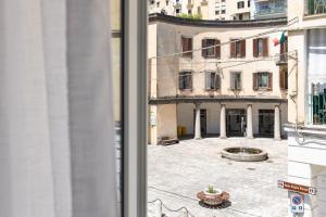 a view of a courtyard from a window of a building at Nimar Suite in Formia