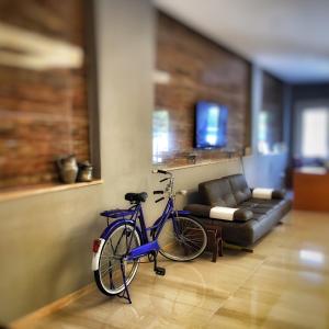 a bike parked in a living room with a couch at Nur Hotel in Kaş