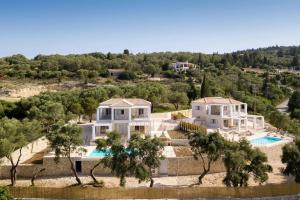 an aerial view of a house with a swimming pool at Tania Villas by PaxosRetreats in Gaios