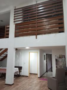 an empty room with a staircase in a building at APARTAMENTO BARRA DO JUCU VISTA MAR in Vila Velha
