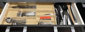 a drawer full of utensils in a kitchen at Ferienwohnung mit großer Dachterrasse in Bielefeld
