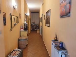a hallway with yellow walls and a long hallway at La capannina cilento cam 12 in San Marco di Castellabate