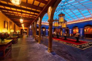 a large building with a glass ceiling and a lobby at Palacio del Inka, a Luxury Collection Hotel, Cusco in Cusco