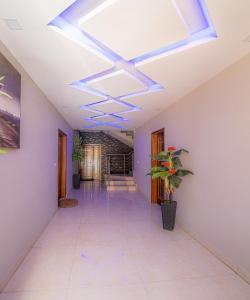 a hallway with a ceiling with a blue light at TERANGA IMMO LUXE in Dakar