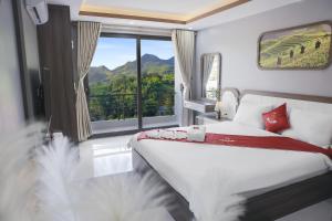 Postel nebo postele na pokoji v ubytování En Hotel Sapa