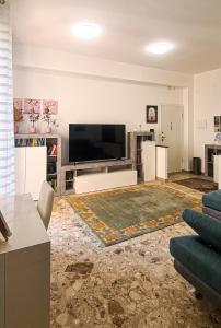 a living room with a large flat screen tv at casapepa in Ancona