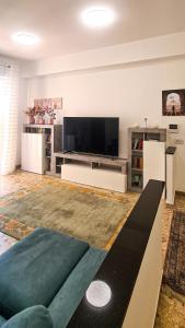 a living room with a large flat screen tv at casapepa in Ancona +19 photos