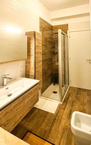 a bathroom with a tub and a shower and a sink at casapepa in Ancona +19 photos