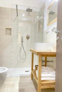 a bathroom with a sink and a shower at CASA SACURI in Rudalza +36 photos
