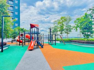 a playground with a slide and slides at 3BR Modern Cozy Suite Near KLIA in Sepang
