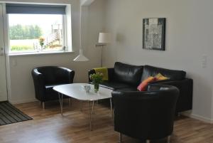 Area soggiorno di Fitting Landsbyferie Apartments