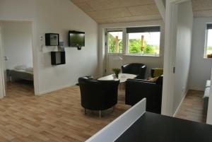 TV o dispositivi per l'intrattenimento presso Fitting Landsbyferie Apartments