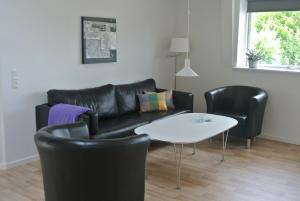 Area soggiorno di Fitting Landsbyferie Apartments
