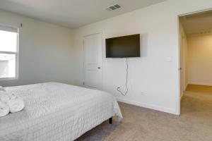 a bedroom with a bed and a flat screen tv at Modern Reno Vacation Home Easy Access to Nature in Reno