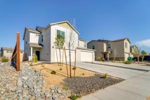 a house on a street with a landscaping with rocks at Modern Reno Vacation Home Easy Access to Nature in Reno