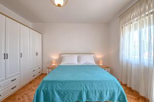 Postel nebo postele na pokoji v ubytování Apartman Ivan