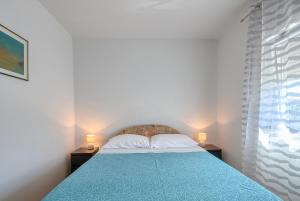 Postel nebo postele na pokoji v ubytování Apartman Ivan