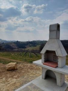 a pizza oven sitting on top of a field at Ruralna kuća za odmor Julijana in Štrigova