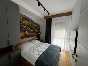Posteľ alebo postele v izbe v ubytovaní DivciCasa apartments Divčibare