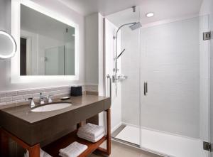 a bathroom with a sink and a shower at The Westin Austin at The Domain in Austin