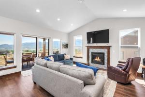 a living room with a couch and a fireplace at Angels Landing in Eden