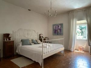 Ein Bett oder Betten in einem Zimmer der Unterkunft Casa Lisette al borgo