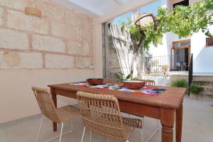a wooden table with two bowls on top of it at 265 Es Colomer ETV11174 by Mallorca Charme in Muro