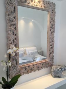 A bed or beds in a room at Bettola del Re home boutique b&b