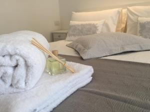 A bed or beds in a room at Bettola del Re home boutique b&b