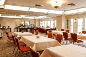 a dining room with tables and chairs in a room at Hotel Osaka Castle in Osaka