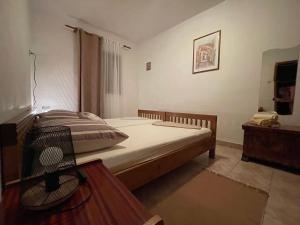 Postel nebo postele na pokoji v ubytování Apartmani Meri