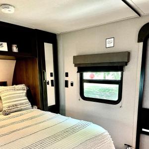 a bedroom with a bed and a window at Pet Friendly Graham Home Route 66 at The Mistletoe Farm in Graham
