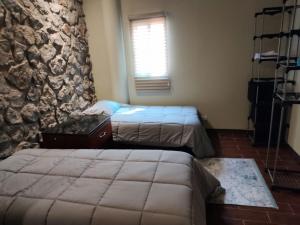 Postel nebo postele na pokoji v ubytování casa consulado