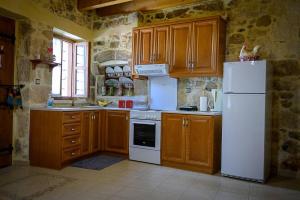 A kitchen or kitchenette at Traditional Stone Mezonete