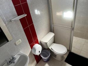 a small bathroom with a toilet and a sink at Apartamento Cerca Al centro in Valledupar