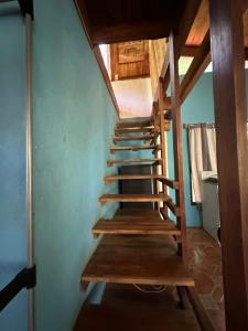 a stairwell in a house with wooden risers at Aldos place in Playa Negra