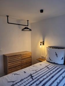 a bedroom with a bed with birds on it at FeWo Todeskino "Möwennest" in Heiligenhafen in Heiligenhafen