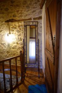 A bed or beds in a room at Traditional Stone Mezonete