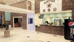 a large lobby with a counter in a store at B&J HOTEL AND APARTMENTS in Pecos