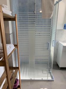 a shower with a glass door in a bathroom at Villa Venezia in Torre di Mosto