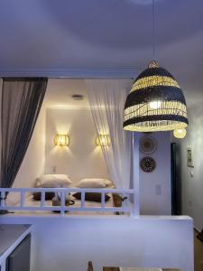 a room with two bunk beds and a chandelier at San Giorgio Leros in Drymonas