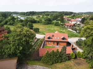 an aerial view of a house in a village at Mazury Haus in Ruciane-Nida