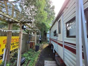 an rv parked in a yard next to a fence at Virginia Vacation duplex house 1 in Virginia Beach